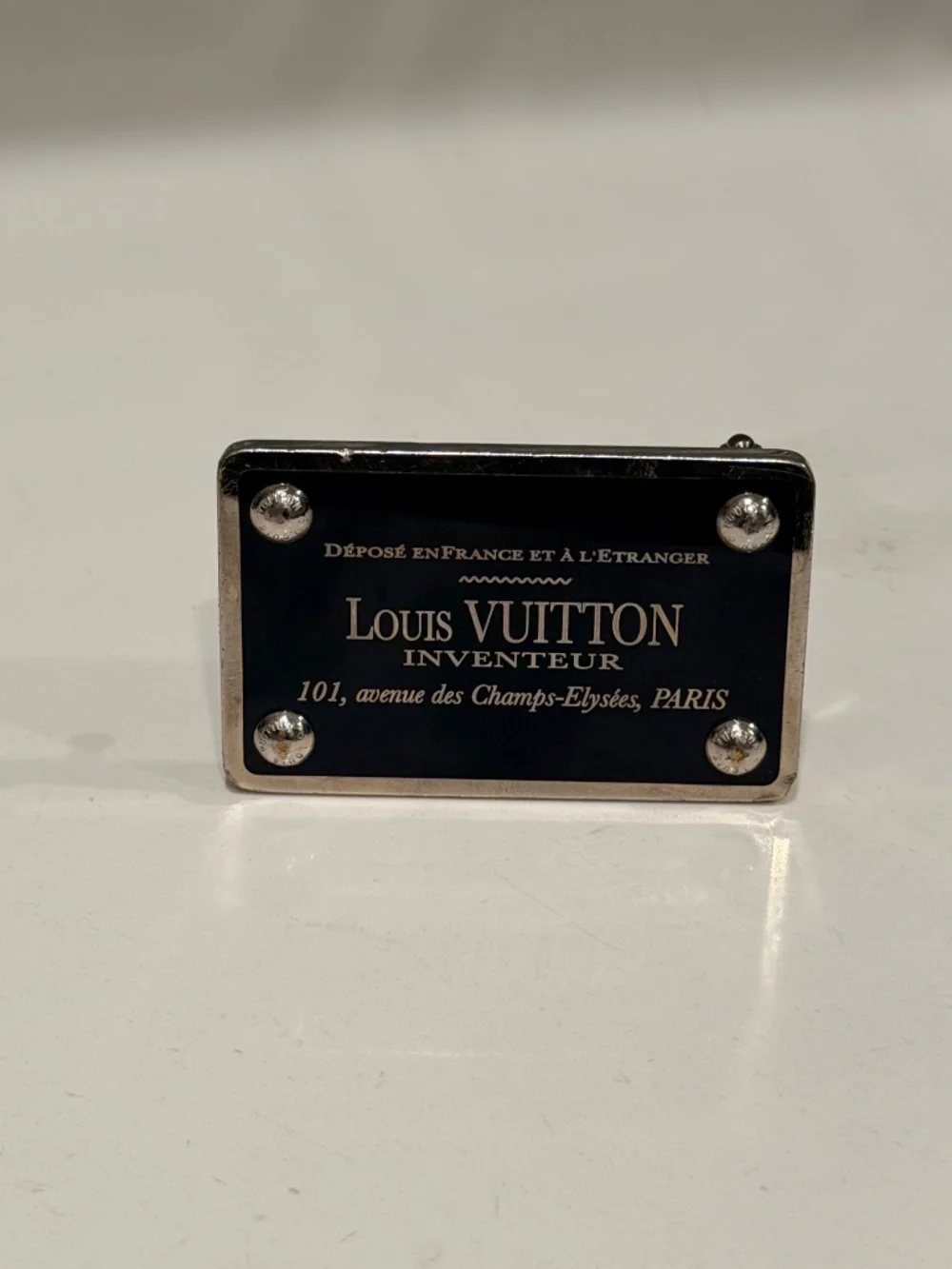 2 Luis Vuitton belt buckles